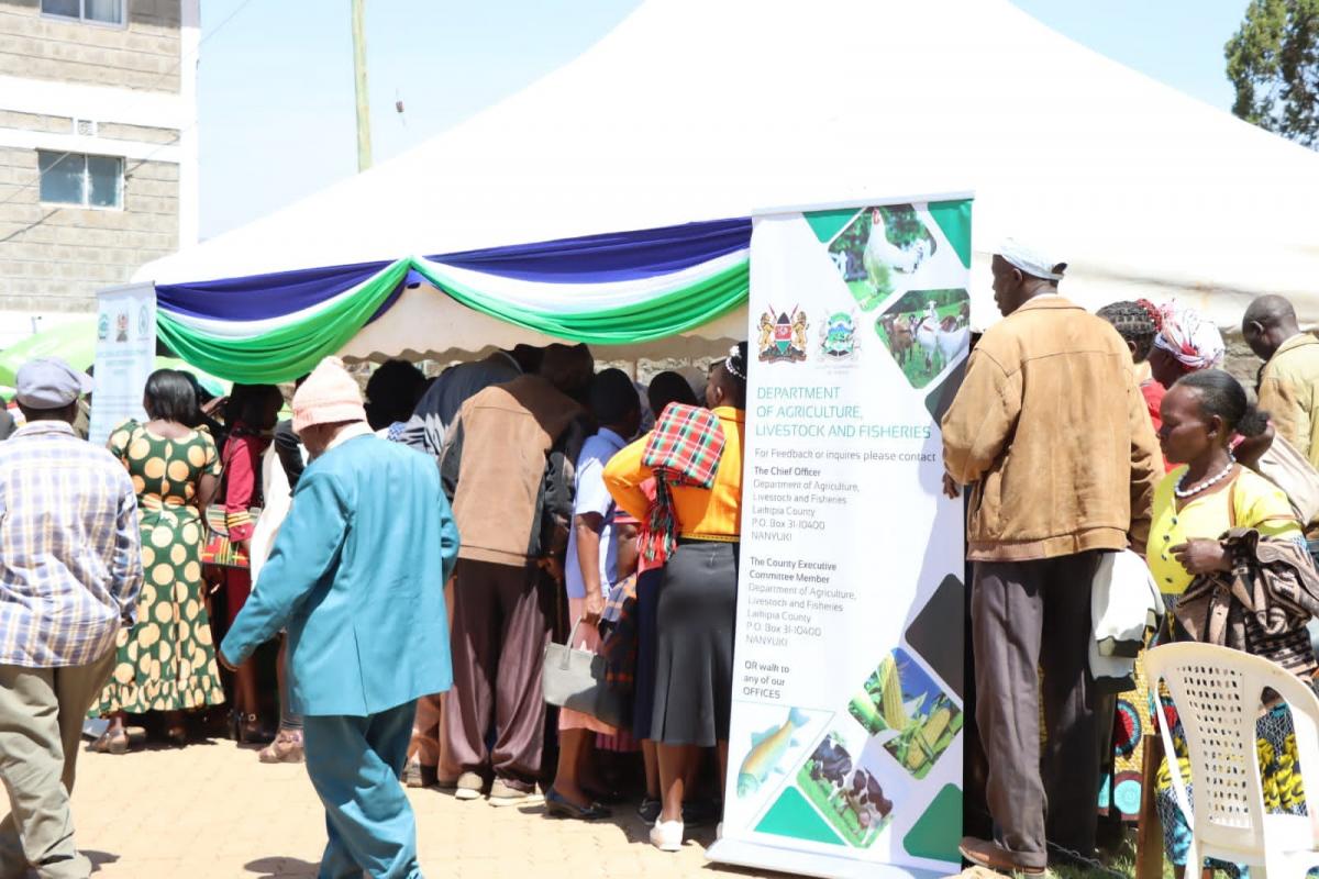 Residents visit the Laikipia County Agriculture Department stand at an agricultural open day.